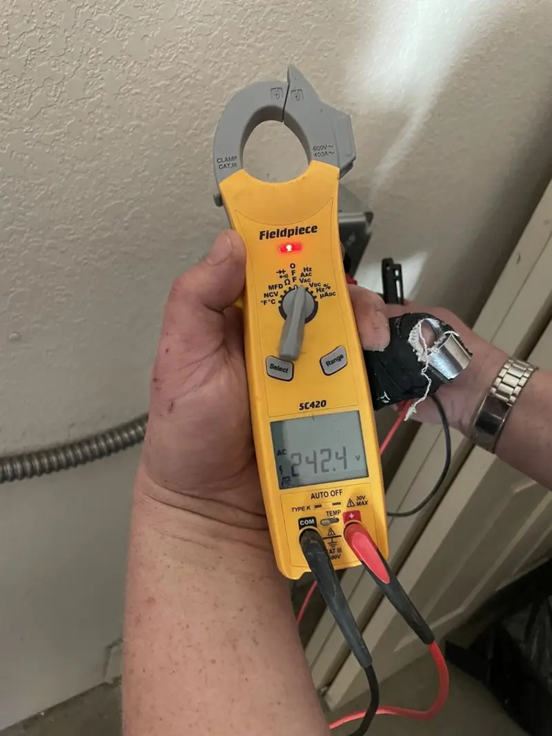 Voltage testing with clamp meter during Generator Installation in West Melbourne